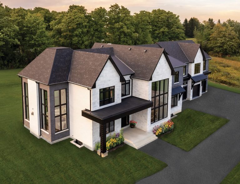 Using Stone and Brick to Structure the Facades of a Large House