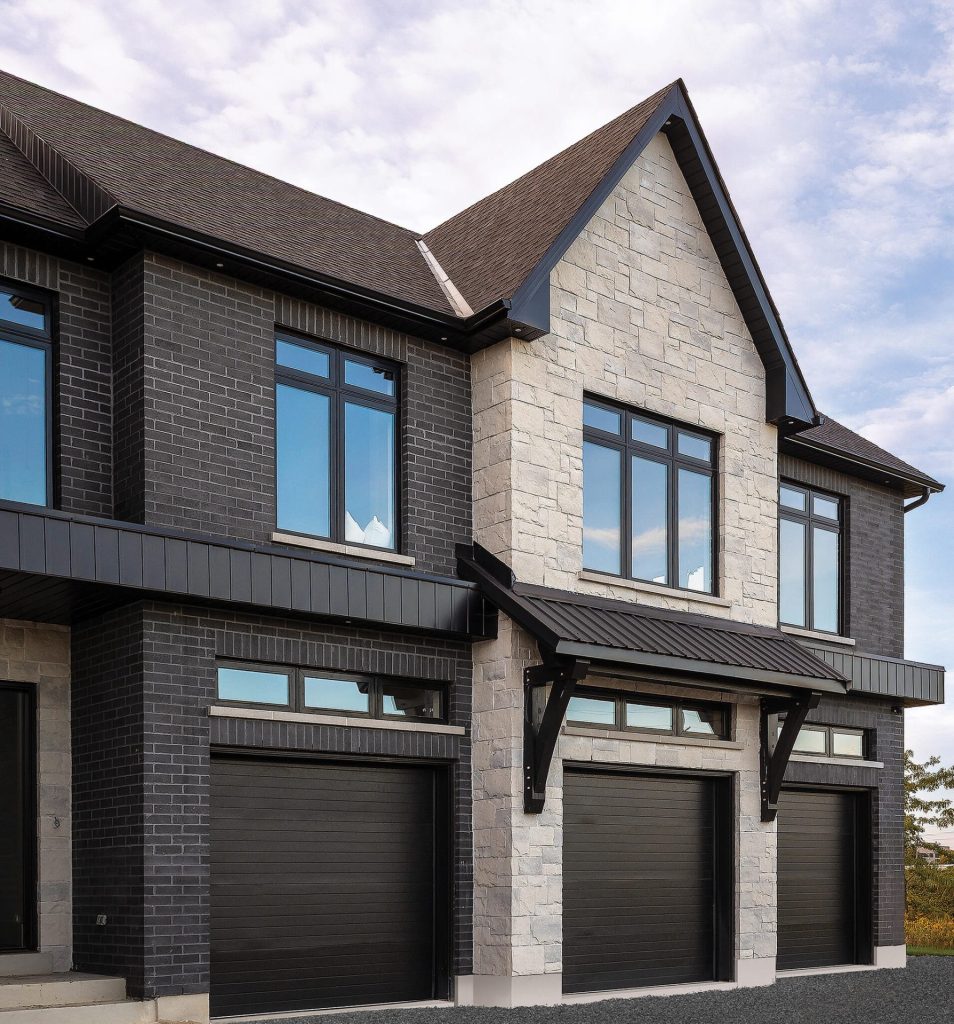 Using Stone and Brick to Structure the Facades of a Large House